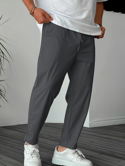 https://cdn.shopify.com/s/files/1/0898/5604/9538/files/Essential-Tapered-Drawstring-Trousers-3.png?v=1748332365